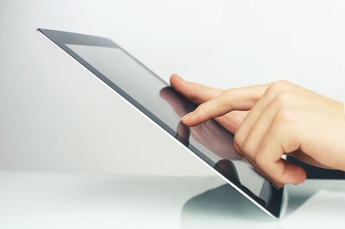 Person holding a tablet Person holding a tablet